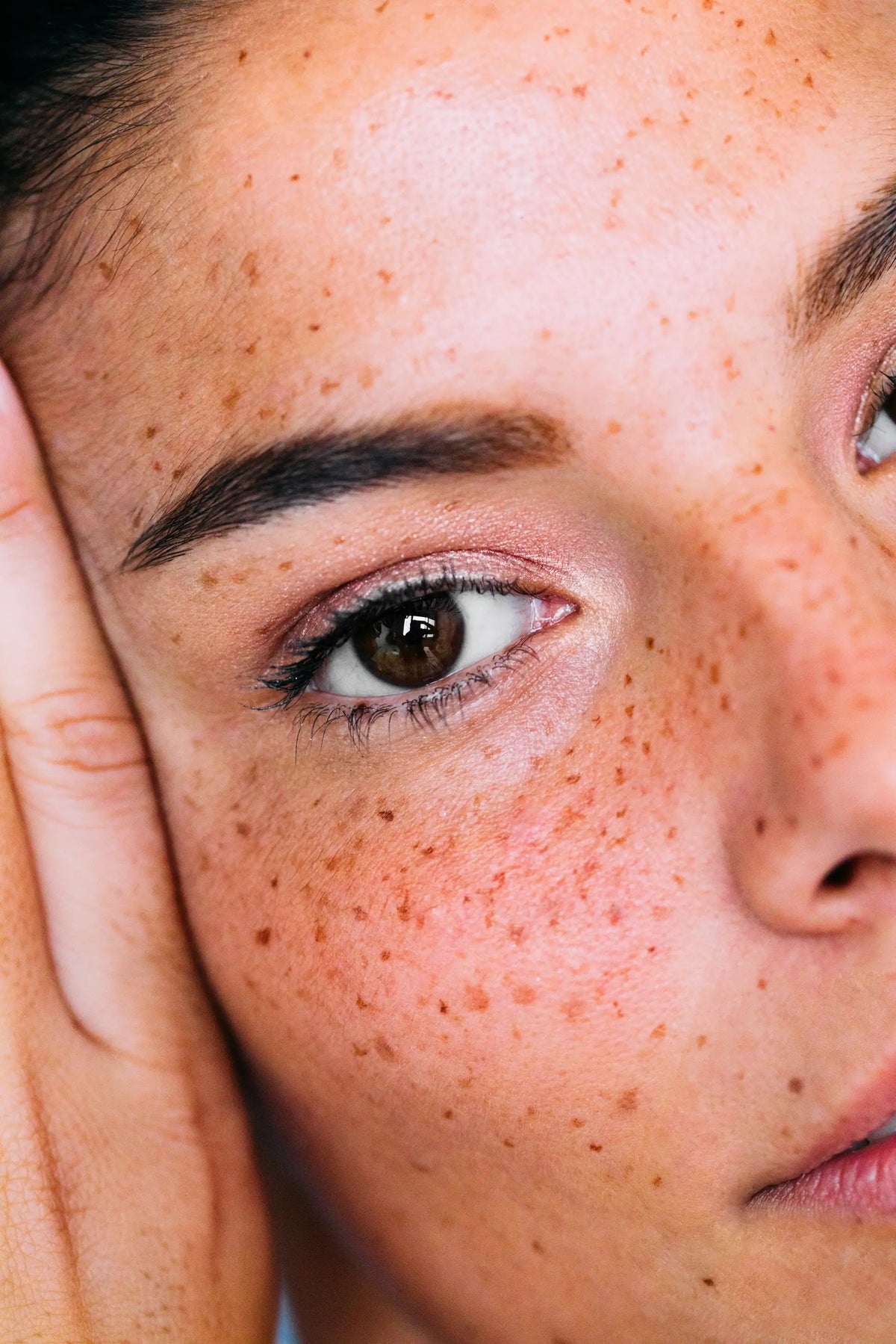 Close-up of a woman's eye, showing bright, clear skin
